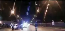  ?? ASSOCIATED PRESS ?? In this 2014 file image taken from dash-cam video provided by the Chicago Police Department, Laquan McDonald, right, walks down the street moments before being fatally shot by Chicago Police officer Jason Van Dyke in Chicago.