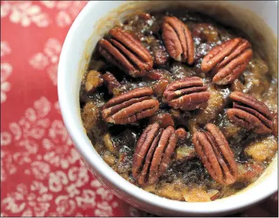  ?? Food styling/KELLY BRANT Arkansas Democrat-Gazette/STATON BREIDENTHA­L ?? Pecan Pie in individual portions is easy to make in the microwave oven.