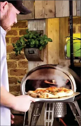  ??  ?? Fast food: Cook pizza on the oven – quicker than it takes to make toast