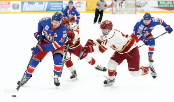  ?? CITIZEN FILE PHOTO ?? Ben Brar of the Prince George Spruce Kings tries to fight off a pair of Chilliwack Chiefs defenders, including Tommy Lee, centre, during a Feb. 2 B.C. Hockey League game at Rolling Mix Concrete Arena. The Kings and Chiefs will open a best-of-seven,...