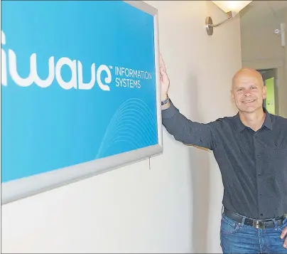  ?? JIM DAY/THE GUARDIAN ?? Gerry Lawless, president and CEO of iWave, poses at the company’s office in Charlottet­own Friday. The P.E.I. software solutions company has been acquired by U.S.-based private equity investment firm Sverica.