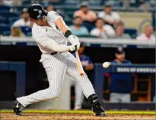  ?? Frank Franklin II / Associated Press ?? Luke Voit of the Yankees hits a two-run double during the third inning against the Twins on Thursday. Voit later scored on a sacrifice fly by Anthony Rizzo.