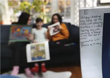  ?? RICHARD LAUTENS/TORONTO STAR ?? Amy Pataki has used wall calendars since 2004 to track the growth of her children, Rebecca and Ella, 13, and Inara, 9.