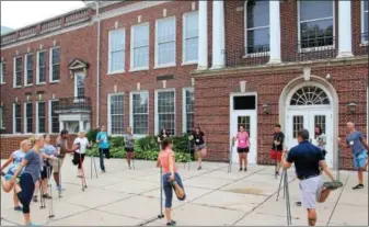  ?? PHOTOS BY MICHILEA PATTERSON — DIGITAL FIRST MEDIA ?? Educators practice Nordic walking during this year’s “Healthy Bodies, Healthy Minds Institute” at Pottstown Middle School.