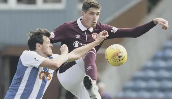  ??  ?? 2 Kilmarnock’s Gordon Greer challenges Kyle Lafferty of Hearts at Rugby Park on Saturday.