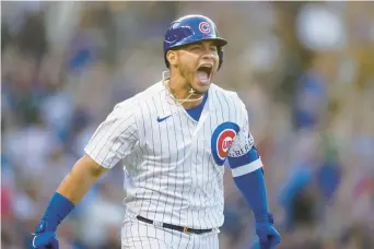  ?? ARMANDO L. SANCHEZ/CHICAGO TRIBUNE ?? The Cubs’ Willson Contreras yells after hitting a grand slam during the first inning Monday against the Pirates at Wrigley Field.