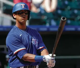  ?? Christian Petersen / Getty Images ?? Khris Davis’ return from a quadriceps injury suffered in spring training will have an effect on the Rangers’ outfield and lineup, especially for Willie Calhoun, Eli White and David Dahl.