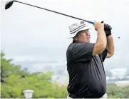  ?? ?? Joggie Badenhorst keeps a close eye on his first tee shot.