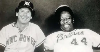  ??  ?? Wayne Norton and Hank Aaron relax during the 1983 Legends Game at BC Place Stadium.