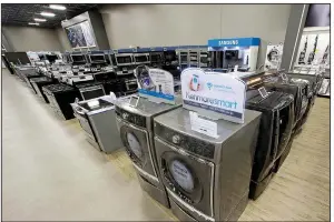  ?? AP/RICK BOWMER ?? Kenmore dryers and washers are displayed at a Sears store in West Jordan, Utah. Orders for durable goods rose 6.5 percent in June, the Commerce Department said Thursday.