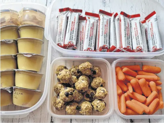  ?? CONTRIBUTE­D ?? Columnist Gina Bell suggests using bins to organize snacks.