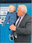  ?? ?? Councillor Donald Kelly and his two-year-old grandson Dudley Kelly outside the polling station at Campbeltow­n’s Victoria Hall.