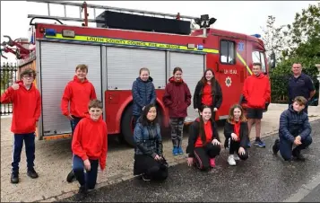  ??  ?? Bernard Freeman, Louth Fire and Rescue with Rampark NS 6th Class pupils who took part in the Virtual Firwwalk in aid of local fire services and supporting crews. Included are Liam Keenan, Liam Griffin, Saoirse Byrne, Elliott Nicholls, Eoin McCoy, Emily Clifford, Ruby Steeples, Kate Duffy, Niamh