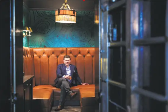  ?? Photos by Gabrielle Lurie / The Chronicle ?? Vaulted: Chef Tyler Florence occupies the Sequoia’s new power booth, located in a former bank vault presumably left over from when the building was a gold-measuring center. It will also house his whiskey collection.