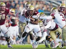  ?? MICHAEL DWYER/ AP PHOTO ?? Boston College running back AJ Dillon (2) carries the ball against Florida State defensive back Derwin James (3) during the first half of a game Oct. 27 in Boston. Dillon, a freshman from New London, has rushed for 100 yards or more four times and...