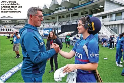  ?? ?? Amy Jones is congratula­ted by England coach Jon Lewis after her match-winning 92