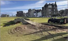  ?? SADIE GOLEN VIA AP ?? Constructi­on continues to restore the area around the Swilcan Bridge — which has been there for 700years — on the 18th hole of the Old Course at St. Andrews on Tuesday.