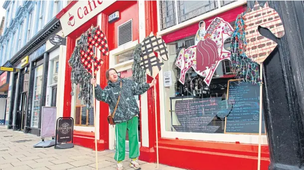  ??  ?? WINDOW SPACE: Artist Mandy Mcintosh outside Caffe Barista in Arbroath where she installed a Pageant for Gallivants piece last week.