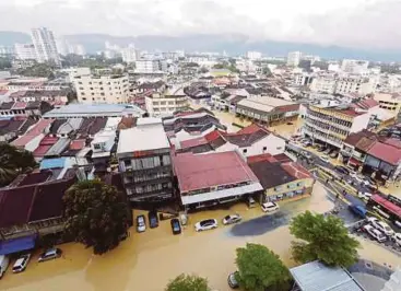  ?? FILE PIC ?? Several parts of Penang, Kedah and Perak were flooded following continuous heavy rain in November last year. It was estimated in 2014, flood damage in nine states amounted to RM1 billion.