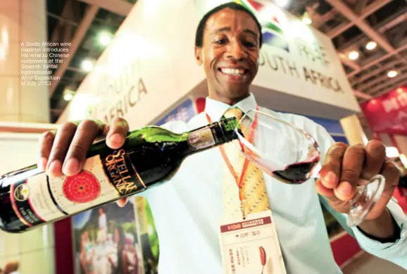  ??  ?? A South African wine exporter introduces his wine to Chinese customers at the Seventh Yantai Internatio­nalWine Exposition in July 2013