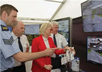  ??  ?? Cllr Sharon Keogan and Gardai check out the new CCTV system which has been installed in Duleek.