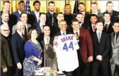  ?? AFP ?? US President Barack Obama poses with a jersey as he welcomes the world champion Chicago Cubs to the White House on Monday.