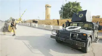  ?? — AFP file photo ?? Iraqi counter-terrorism forces stand guard in front of the US embassy in the capital Baghdad.