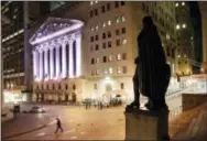  ?? MARK LENNIHAN — THE ASSOCIATED PRESS FILE ?? A statue of George Washington stands near the New York Stock Exchange, in background.