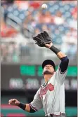  ?? Carolyn Kaster / AP ?? Atlanta third baseman Rio Ruiz catches a pop fly during the first inning of Wednesday’s game.