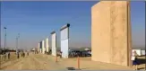  ?? The Associated Press ?? The federal government has started work on a border wall in California to replace a decades-old decaying barrier. File photo shows prototypes.