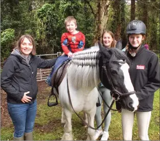  ?? ?? Children enjoying horse riding during the fundraisin­g event at the Rectory of Garrison Parish Church.