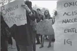  ?? SCOTT OLSON, GETTY IMAGES ?? Students at the University of Chicago participat­e in a walk-out and rally to protest President-elect Donald Trump this week in Chicago.