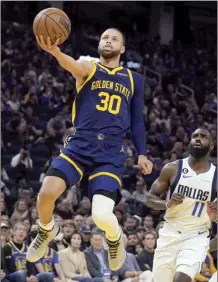  ?? AP photo ?? Stephen Curry left Saturday’s game against Dallas in the third quarter after his wrapped left leg — which he originally hurt Thursday against Denver — appeared to buckle as he played defense.