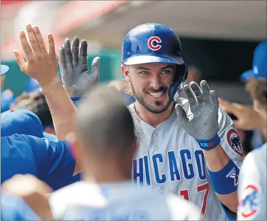  ?? GARY LANDERS/AP ?? “You’ve got to change your ways a little bit and try to establish new routines,” Cubs slugger Kris Bryant said about rules banning spitting and high-fives to stop the spread of COVID-19.