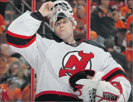  ?? — GETTY IMAGES ?? Devils goalie Martin Brodeur takes a breather during Game 1 against the Flyers last Sunday at the Wells Fargo Center in Philadelph­ia. Philly defeated New Jersey 4-3 in overtime.