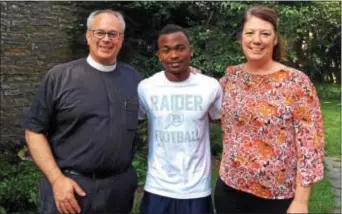  ??  ?? The Rev. Joseph Smith, Samuel Cyubahiro and Sharon Smith outside Church rectory in Wayne. St. Mary’s Episcopal