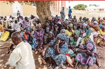  ?? AFP PIC ?? Parents and relatives attending a commemorat­ion in Chibok, Nigeria, on April 14, 2019, five years after 276 girls were abducted by the Boko Haram group. A decade since the mass abduction, almost 100 girls are still thought to be in captivity.