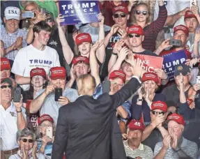  ?? DREW ANGERER/GETTY IMAGES ?? The crowd cheers at the end of one of President Donald Trump’s “Make America Great Again” rallies May 20 in Montoursvi­lle, Pa.