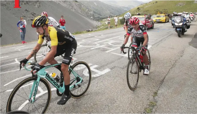  ?? —AP ?? SERRE-CHEVALIER: Stage winner Slovenia’s Primoz Roglic, left, and Colombia’s Jhon Darwin Atapuma, right, climb during the seventeent­h stage of the Tour de France cycling race over 183 kilometers (113.7 miles) with start in La Mure and finish in...