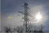  ?? RON JENKINS GETTY IMAGES ?? Transmissi­on towers support power lines in Fort Worth, Texas, where a storm caused blackouts.