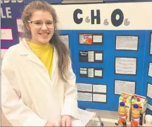  ?? ETHAN PAQUET/JOURNAL PIONEER ?? Grade 9 student Anna Clark shows the results of her study at the Summerside Intermedia­te School science fair March 7.