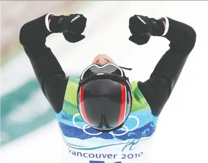  ?? JEAN LEVAC / CANWEST NEWS SERVICE ?? Gold medal winner Simon Ammann of Switzerlan­d celebrates his victory in the men's ski jumping NH Individual Final Round in Whistler, B.C., on Feb. 13, 2010.