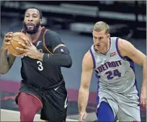  ?? Tony Dejak Associated Press ?? ANDRE DRUMMOND, guarded by Detroit’s Mason Plumlee, averaged 17.3 points and 13.5 rebounds for Cleveland this season.