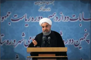  ?? AHMAD HALABISAZ/XINHUA ?? Iranian President Hassan Rouhani delivers a speech on April 14 at the Interior Ministry in Tehran, capital of Iran.