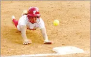  ?? Mark Humphrey/Enterprise-Leader ?? The ball bounces off Farmington’s Amia Carr as she dives back to first base when a fly ball was caught in right field. The relay to first base struck Carr and she was awarded a base, advancing to second on the play. Farmington couldn’t capitalize and lost 10-6 to Gravette in 4A-1 Conference action at Randy Osnes Field on Friday, April 7.