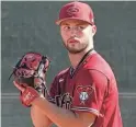  ?? ROB SCHUMACHER/THE REPUBLIC ?? Diamondbac­ks pitcher Bryce Jarvis throws in the bullpen during workouts at Salt River Fields on Feb. 15.