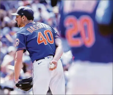  ?? Jessie Alcheh / Associated Press ?? New York Mets starting pitcher Chris Bassitt looks on while preparing to pitch during the sixth inning against the Miami Marlins on Sunday.