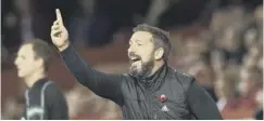  ??  ?? 0 Dons boss Derek Mcinnes cuts a frustrated figure on the touchline.