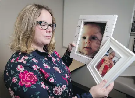  ?? LYLE ASPINALL ?? Sarah Cormier holds photos of her daughter Quinn, a victim of SIDS at age four months, at the University of Calgary on Thursday. “Quinn was absolutely perfect right away, was a great sleeper, rarely cried,” the grieving mother said. “It’s hard to...