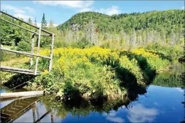  ?? ELIZABETH ZACH FOR THE WASHINGTON POST ?? The P’tit Train du Nord bicycle path in the Laurentian Mountains, about 144 kilometres outside of Montreal, skirts the Riviere du Nord.